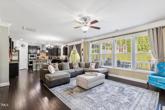 90 E Calvert Ct, Clayton, NC 27527 - living area featuring crown molding, ceiling fan, a chandelier, dark wood-type flooring, and recessed lighting