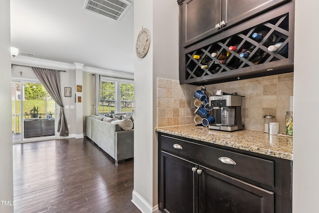90 E Calvert Ct, Clayton, NC 27527 - indoor dry bar with tasteful backsplash, plenty of natural light, dark wood finished floors, and crown molding