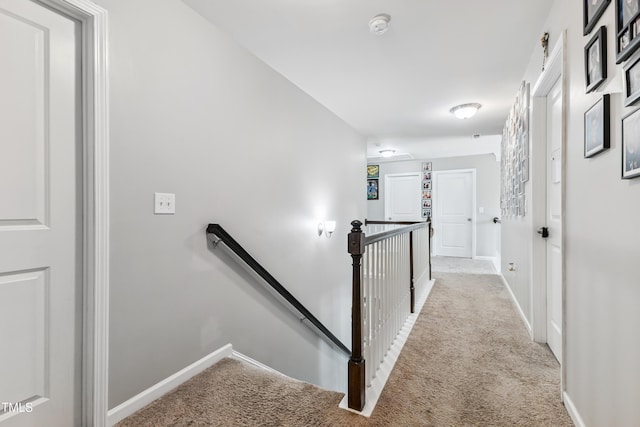 90 E Calvert Ct, Clayton, NC 27527 - corridor with an upstairs landing and carpet flooring