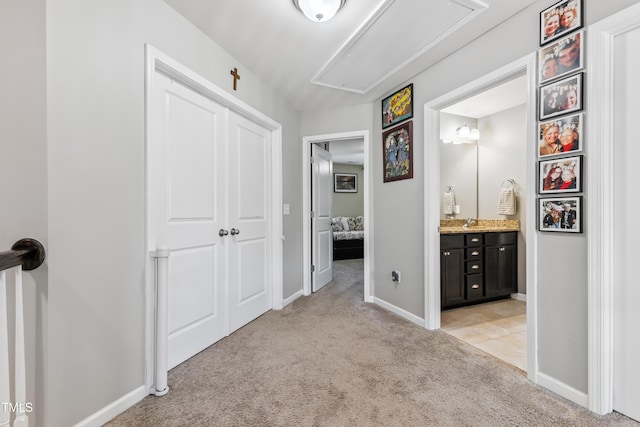 90 E Calvert Ct, Clayton, NC 27527 - hallway featuring attic access and light carpet