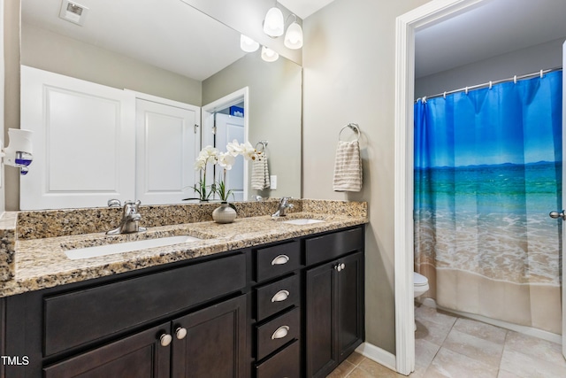 90 E Calvert Ct, Clayton, NC 27527 - bathroom with double vanity and tile patterned floors