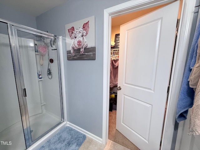 90 E Calvert Ct, Clayton, NC 27527 - bathroom featuring a shower stall and a walk in closet