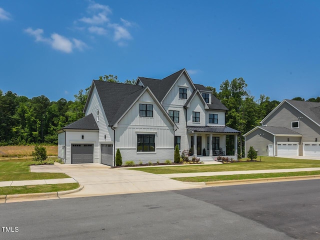 3666 Jordan Estates Way, New Hill, NC 27562 - modern farmhouse with board and batten siding, a front yard, concrete driveway, and covered porch