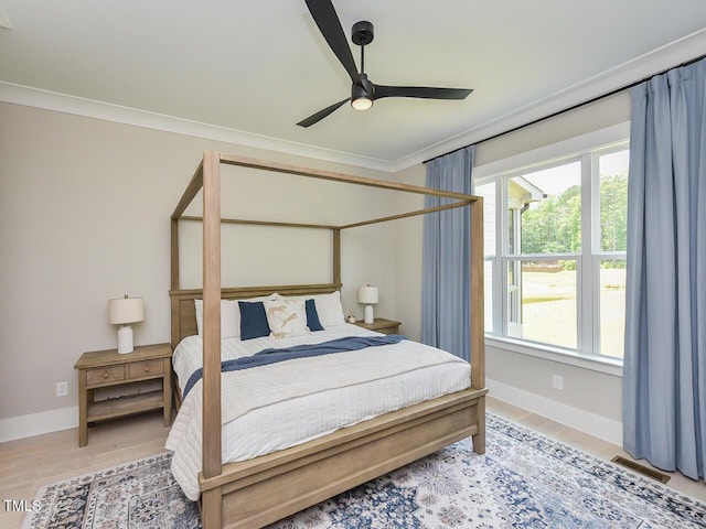 3666 Jordan Estates Way, New Hill, NC 27562 - bedroom with light wood-style flooring, ornamental molding, and a ceiling fan