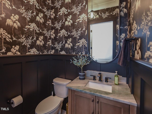 3666 Jordan Estates Way, New Hill, NC 27562 - bathroom with wallpapered walls, vanity, wainscoting, and a decorative wall