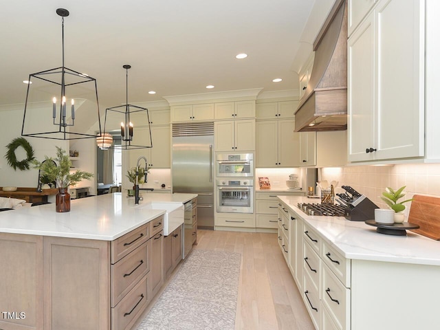 3666 Jordan Estates Way, New Hill, NC 27562 - kitchen with custom range hood, a chandelier, decorative backsplash, stainless steel appliances, and a spacious island