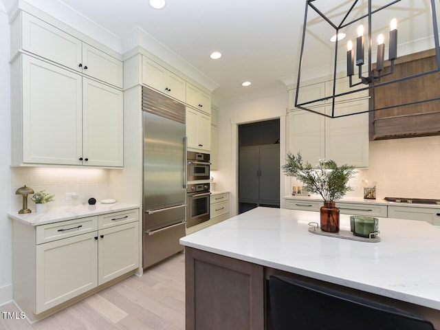 3666 Jordan Estates Way, New Hill, NC 27562 - kitchen featuring appliances with stainless steel finishes, tasteful backsplash, light wood finished floors, pendant lighting, and recessed lighting