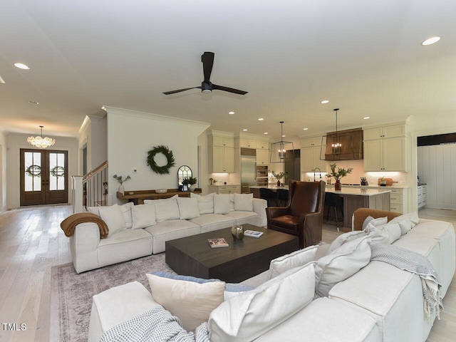 3666 Jordan Estates Way, New Hill, NC 27562 - living area featuring stairs, a ceiling fan, recessed lighting, light wood finished floors, and a chandelier