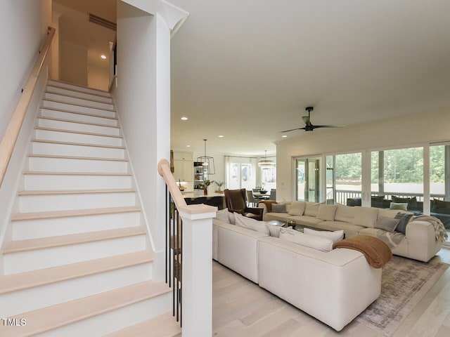 3666 Jordan Estates Way, New Hill, NC 27562 - living area featuring a ceiling fan, light wood-style floors, stairway, recessed lighting, and a chandelier