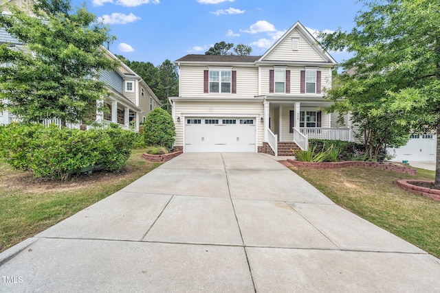 316 Rapport Dr, Cary, NC 27519 - traditional home with a porch, driveway, a front yard, and a garage