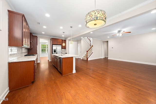 316 Rapport Dr, Cary, NC 27519 - kitchen featuring crown molding, appliances with stainless steel finishes, recessed lighting, a center island with sink, and a ceiling fan