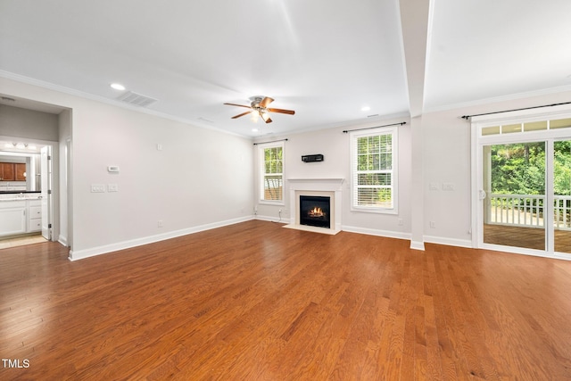 316 Rapport Dr, Cary, NC 27519 - unfurnished living room with ceiling fan, a fireplace with flush hearth, crown molding, light wood-type flooring, and recessed lighting
