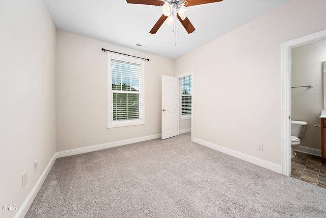 316 Rapport Dr, Cary, NC 27519 - unfurnished bedroom featuring carpet floors, ensuite bath, and ceiling fan