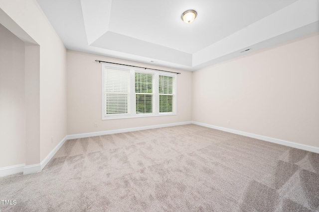 316 Rapport Dr, Cary, NC 27519 - empty room with a raised ceiling and carpet flooring
