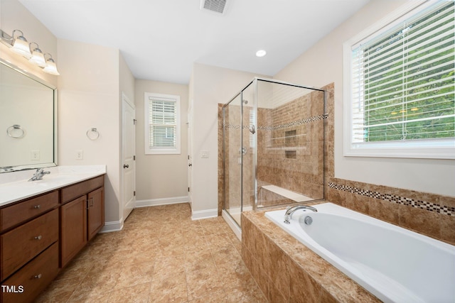 316 Rapport Dr, Cary, NC 27519 - full bathroom with vanity, a garden tub, and a stall shower