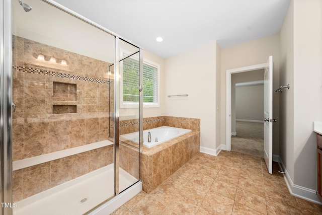 316 Rapport Dr, Cary, NC 27519 - full bathroom featuring a garden tub, a shower stall, vanity, and tile patterned flooring