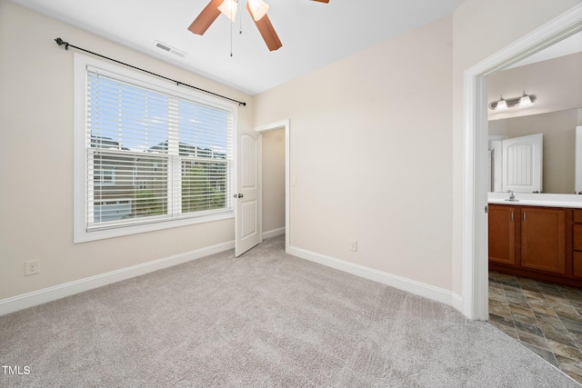316 Rapport Dr, Cary, NC 27519 - unfurnished bedroom featuring carpet, ensuite bath, and ceiling fan