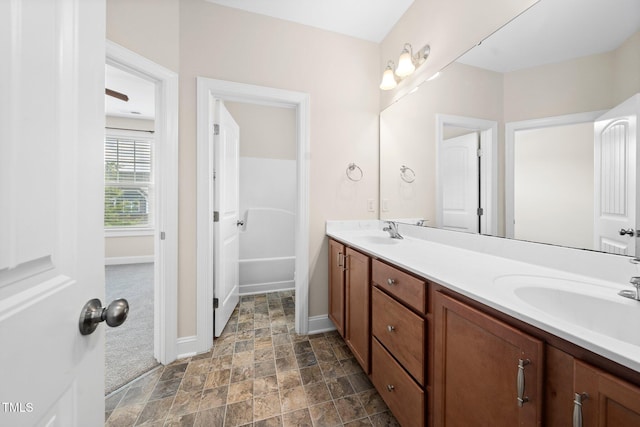 316 Rapport Dr, Cary, NC 27519 - bathroom featuring double vanity and stone finish floors