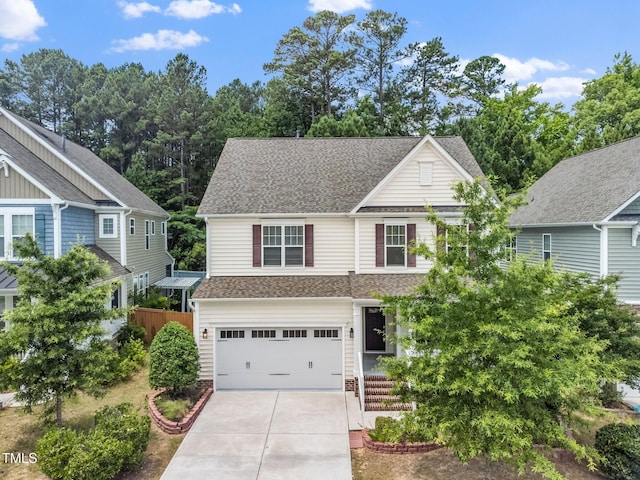 316 Rapport Dr, Cary, NC 27519 - view of front of home featuring driveway, a shingled roof, and a garage