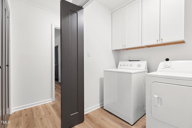 110 Mossbark Ln, Chapel Hill, NC 27514 - washroom with cabinet space, separate washer and dryer, and light wood-style floors