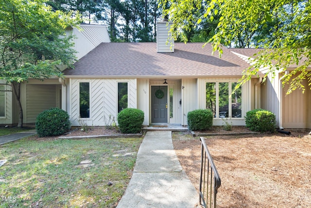 110 Mossbark Ln, Chapel Hill, NC 27514 - mid-century inspired home with roof with shingles and a chimney
