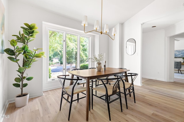 110 Mossbark Ln, Chapel Hill, NC 27514 - dining space with light wood-type flooring, healthy amount of natural light, and a chandelier