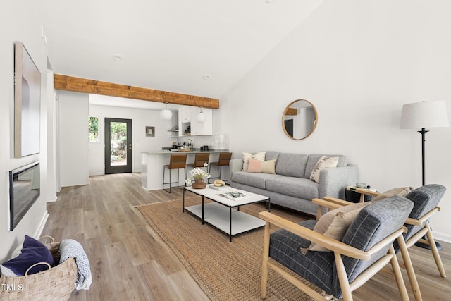 110 Mossbark Ln, Chapel Hill, NC 27514 - living area featuring light wood-style flooring and beamed ceiling
