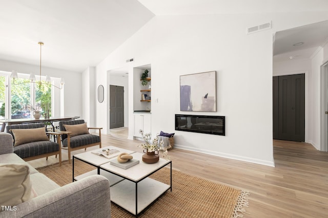 110 Mossbark Ln, Chapel Hill, NC 27514 - living area featuring light wood-style floors and high vaulted ceiling