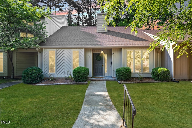 110 Mossbark Ln, Chapel Hill, NC 27514 - mid-century home featuring roof with shingles, a chimney, and a front yard