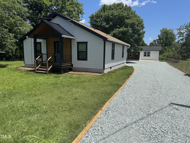 3241 Rowena, Durham, NC 27703 - view of front of house featuring gravel driveway and crawl space