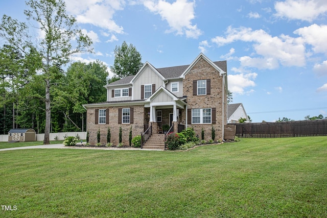3082 Cascade Dr, Burlington, NC 27217 - craftsman house with board and batten siding, a storage unit, and brick siding