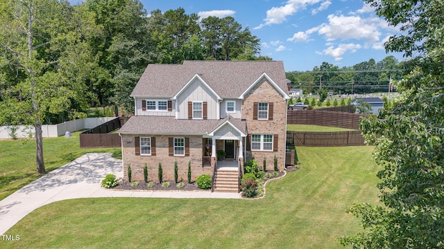 3082 Cascade Dr, Burlington, NC 27217 - view of front of property featuring brick siding, board and batten siding, driveway, and a shingled roof