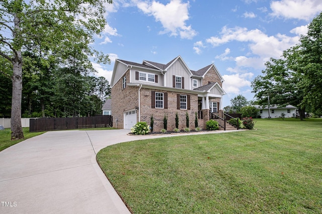 3082 Cascade Dr, Burlington, NC 27217 - view of front of home featuring driveway, a garage, brick siding, and board and batten siding