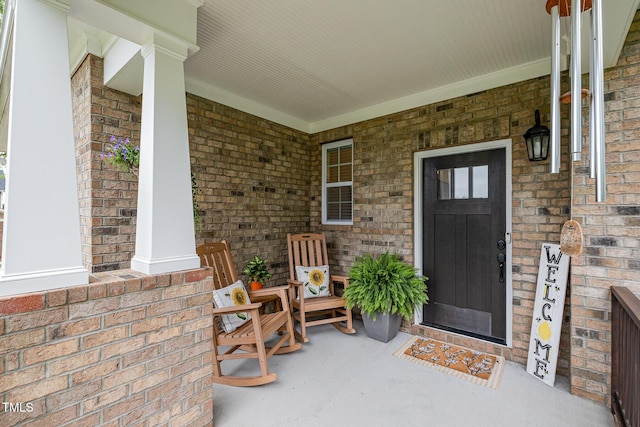 3082 Cascade Dr, Burlington, NC 27217 - doorway to property with covered porch and brick siding