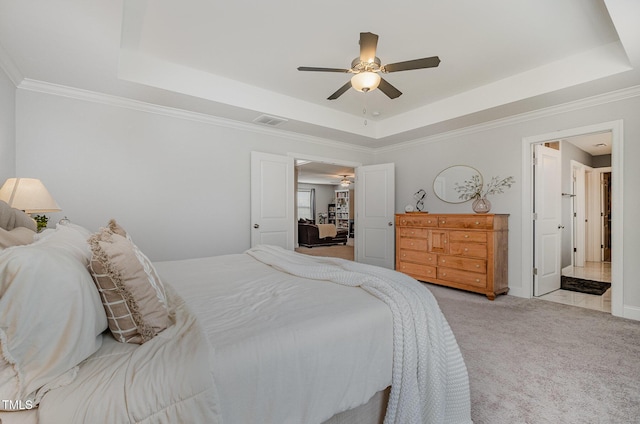 3082 Cascade Dr, Burlington, NC 27217 - bedroom with a tray ceiling, light colored carpet, ceiling fan, and ornamental molding