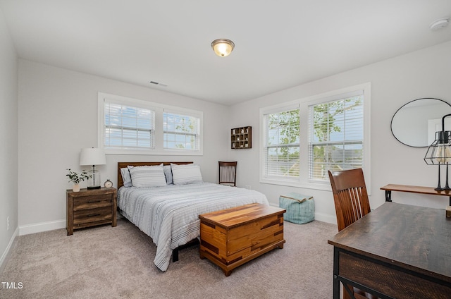 3082 Cascade Dr, Burlington, NC 27217 - bedroom with multiple windows and light colored carpet