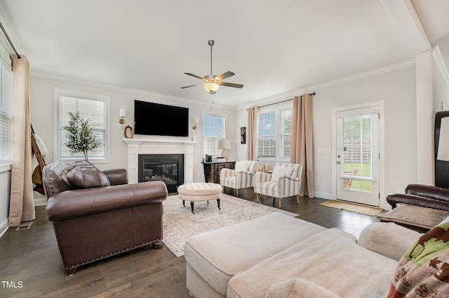 3082 Cascade Dr, Burlington, NC 27217 - living room with crown molding, dark wood finished floors, a glass covered fireplace, and a ceiling fan