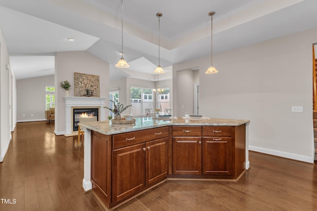 936 Blue Bird Ln, Wake Forest, NC 27587 - kitchen with dark wood-type flooring, light stone countertops, hanging light fixtures, plenty of natural light, and lofted ceiling