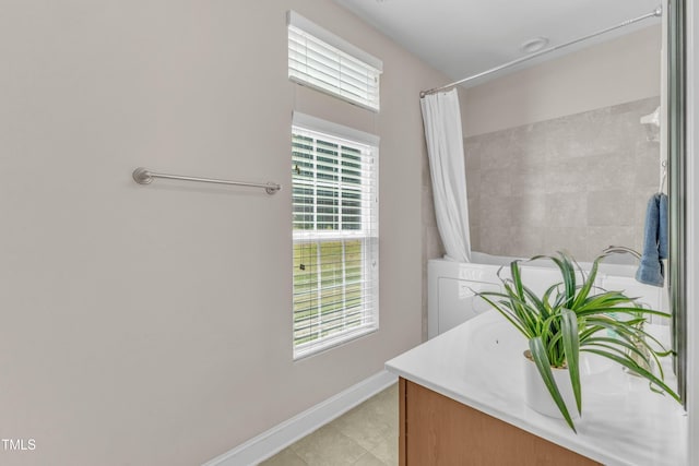 936 Blue Bird Ln, Wake Forest, NC 27587 - full bath with vanity, a shower with shower curtain, and tile patterned flooring