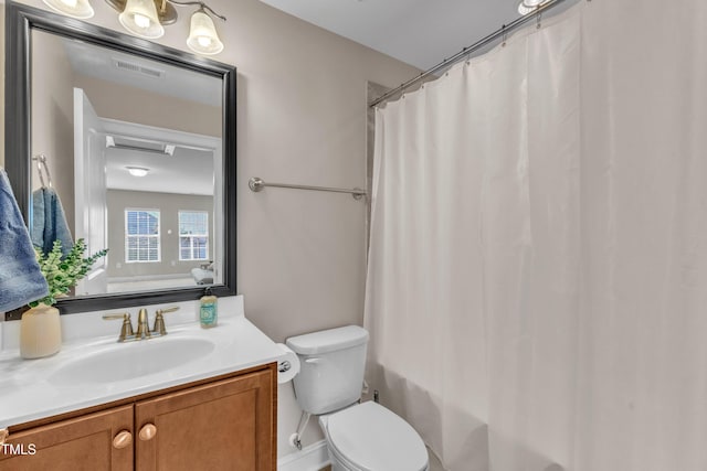 936 Blue Bird Ln, Wake Forest, NC 27587 - bathroom featuring vanity and shower / bath combo with shower curtain