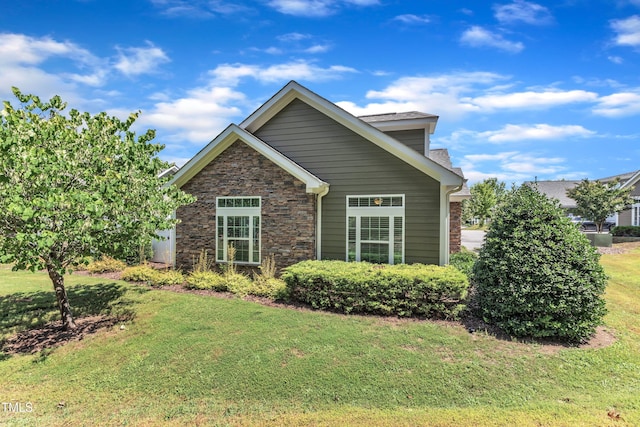 936 Blue Bird Ln, Wake Forest, NC 27587 - view of front facade with a front lawn and stone siding