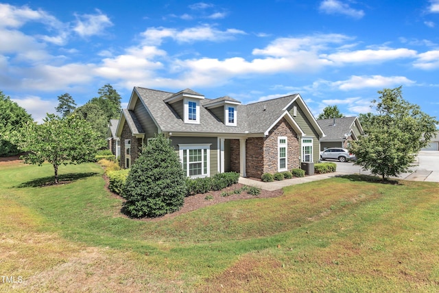 936 Blue Bird Ln, Wake Forest, NC 27587 - view of front of house featuring stone siding, a front yard, and a shingled roof