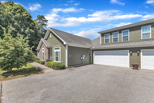 936 Blue Bird Ln, Wake Forest, NC 27587 - view of front of property with driveway, a garage, and a shingled roof
