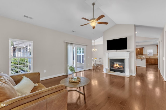 936 Blue Bird Ln, Wake Forest, NC 27587 - living room featuring ceiling fan, wood finished floors, a glass covered fireplace, and high vaulted ceiling
