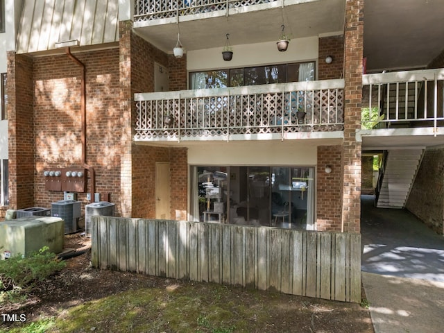 500 Umstead Dr Unit 103C, Chapel Hill, NC 27516 - back of house featuring a balcony and brick siding