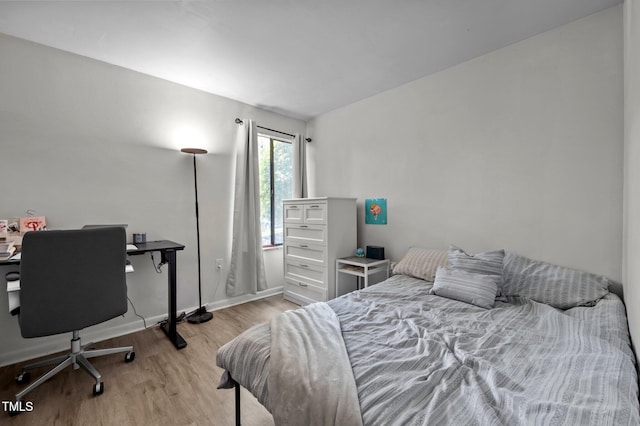 500 Umstead Dr Unit 103C, Chapel Hill, NC 27516 - bedroom with wood finished floors and an office area