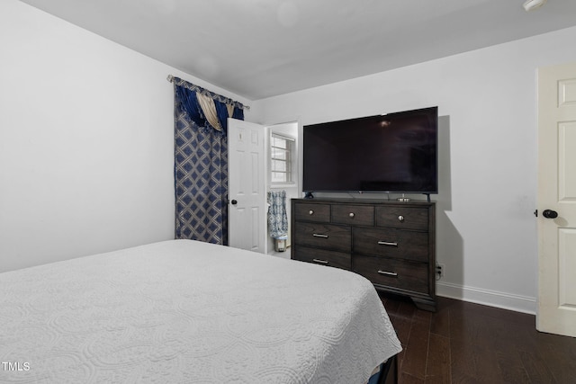 1319 Legend Rd, Raleigh, NC 27603 - bedroom featuring dark wood-style flooring and baseboards