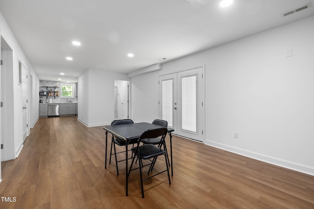 1319 Legend Rd, Raleigh, NC 27603 - dining space with recessed lighting, dark wood finished floors, and french doors
