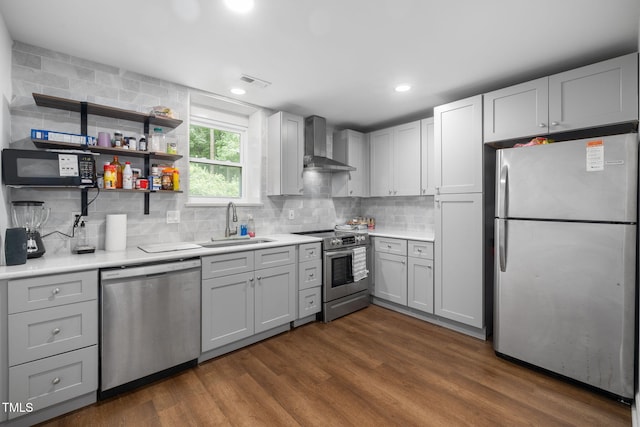 1319 Legend Rd, Raleigh, NC 27603 - kitchen featuring stainless steel appliances, wall chimney exhaust hood, backsplash, light countertops, and recessed lighting