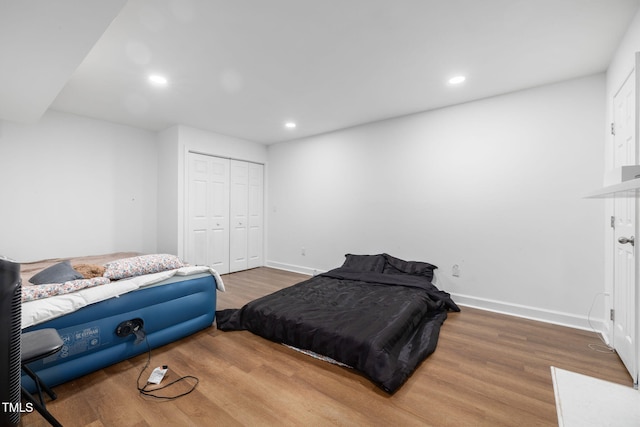 1319 Legend Rd, Raleigh, NC 27603 - bedroom featuring wood finished floors, recessed lighting, and a closet